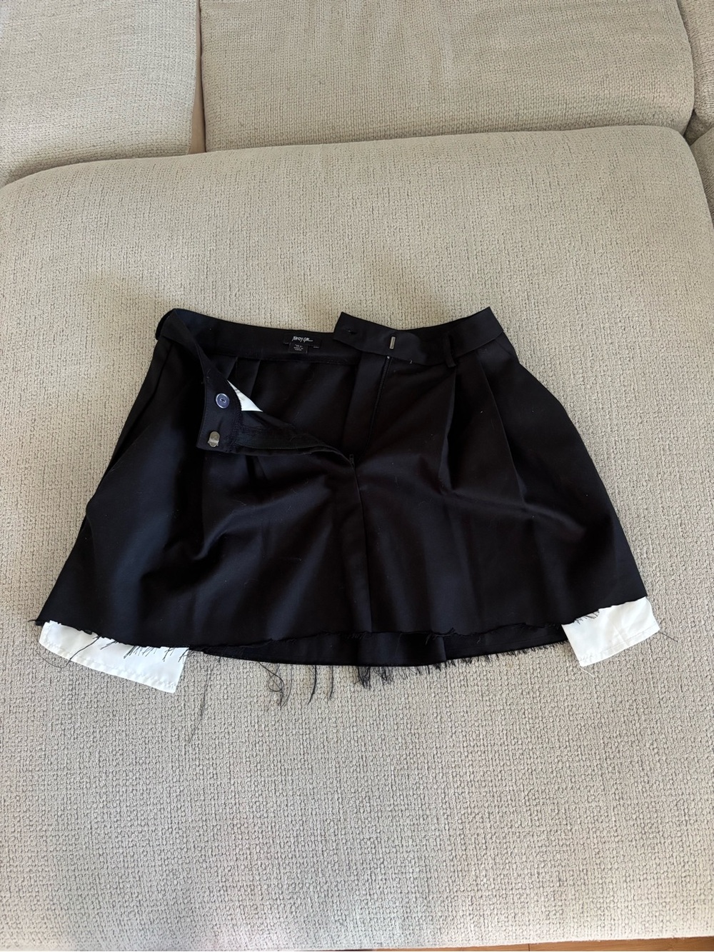 Nasty Gal black mini skirt with pockets showing